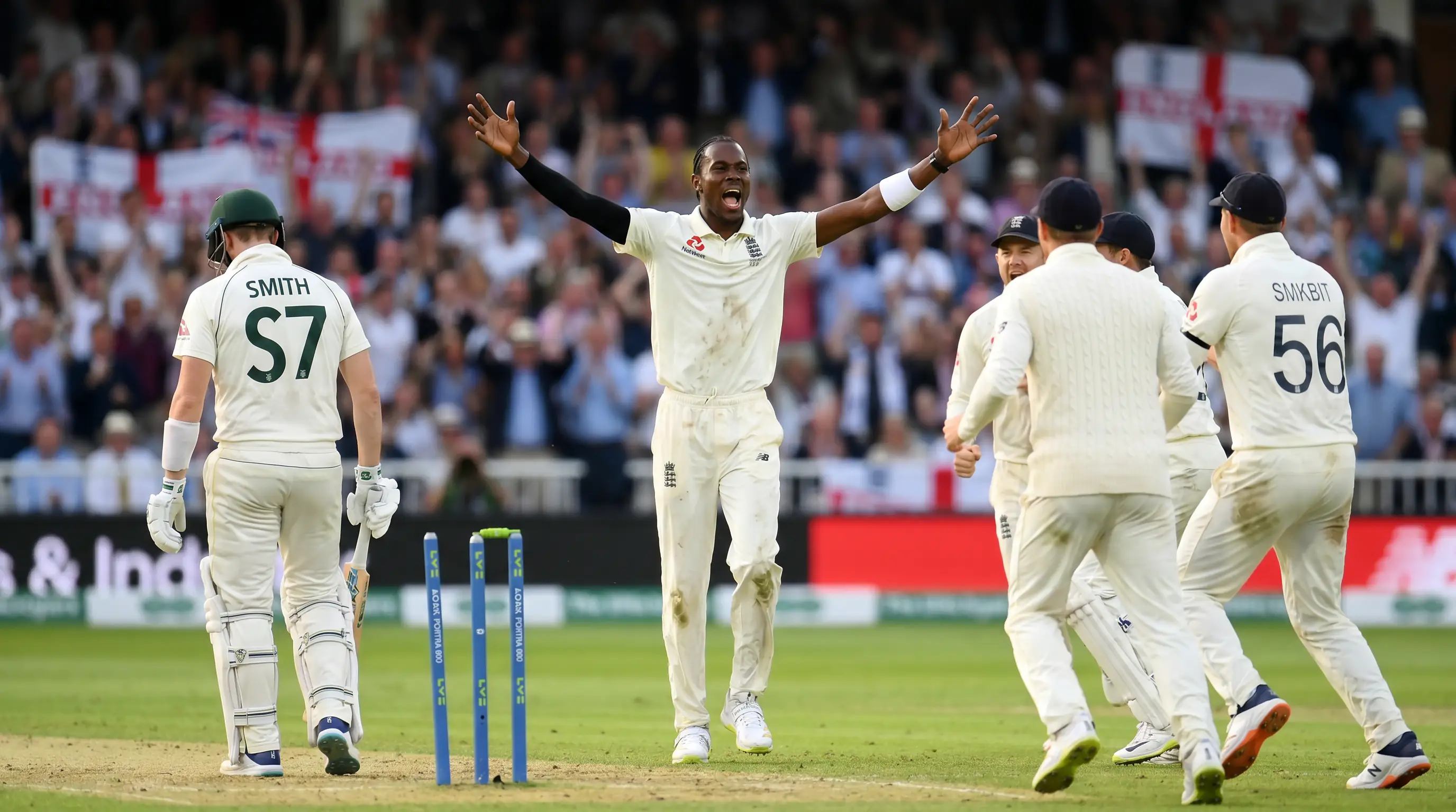 Fast bowler celebrating a wicket during an Ashes Test with teammates rushing in