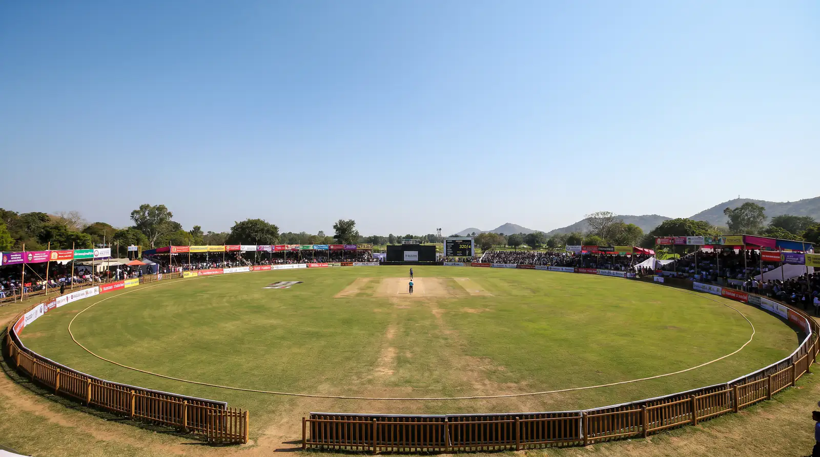 Small cricket ground with short boundaries known for high-scoring matches