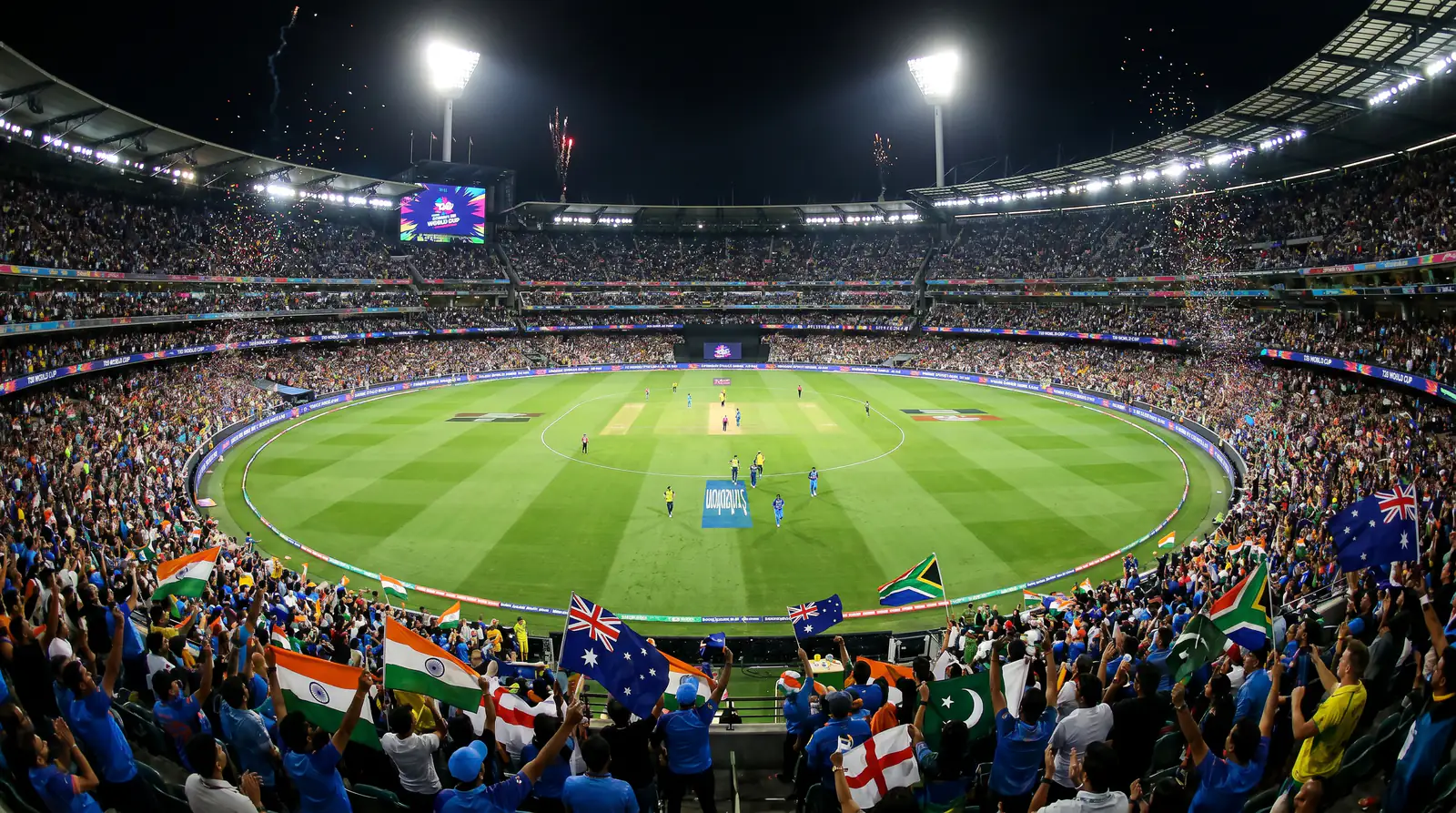 International T20 cricket match with national flags displayed around the stadium